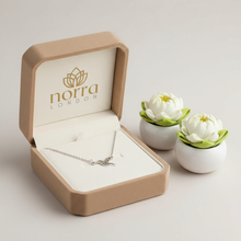 Jewelry box with a Hummingbird Pendant inside, featuring the 'norra London' brand, on a light background.
